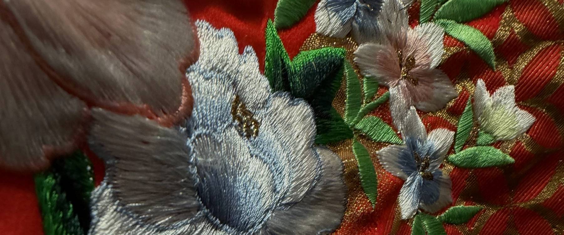Embroidered blue peony on red silk